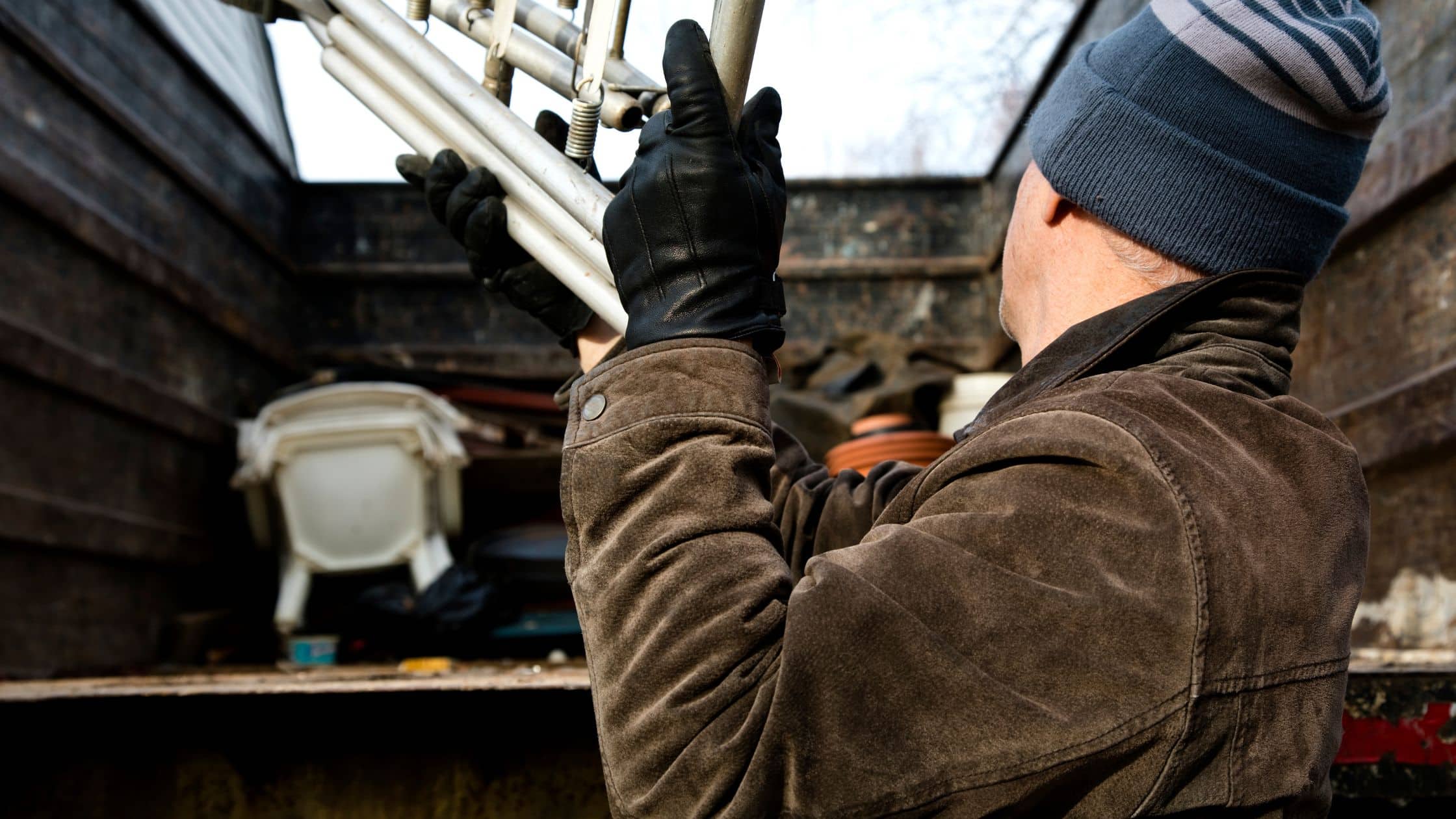Colin Can Help team providing junk removal services in Highland Heights, efficiently loading unwanted items into a truck.
