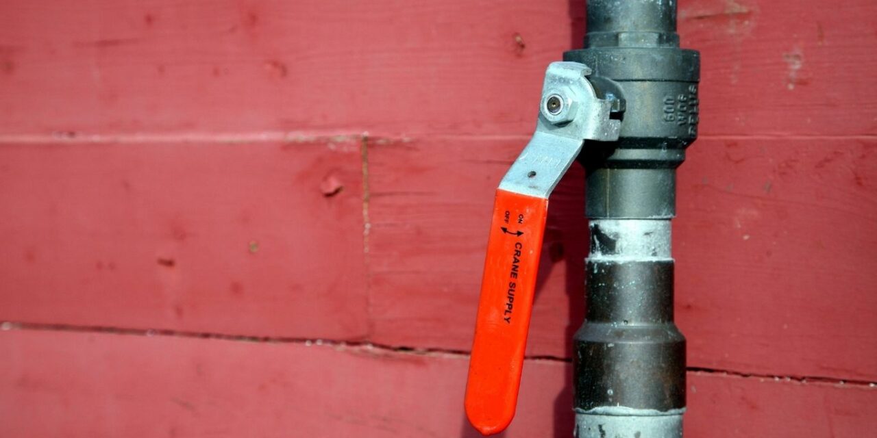 Should I turn off the main valve when leaving for vacation?